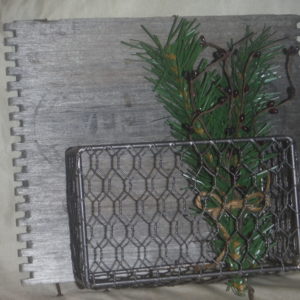 Wire basket with vintage wood plaque